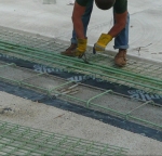 Rebar and fabric coated with epoxy safety powder.