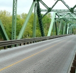Bridge railing with green polyester powder.