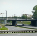 Bridge rail and traffic poles with polyester coating.