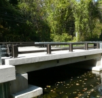 Brown bridge rail with durable TGIC polyester powder coat.